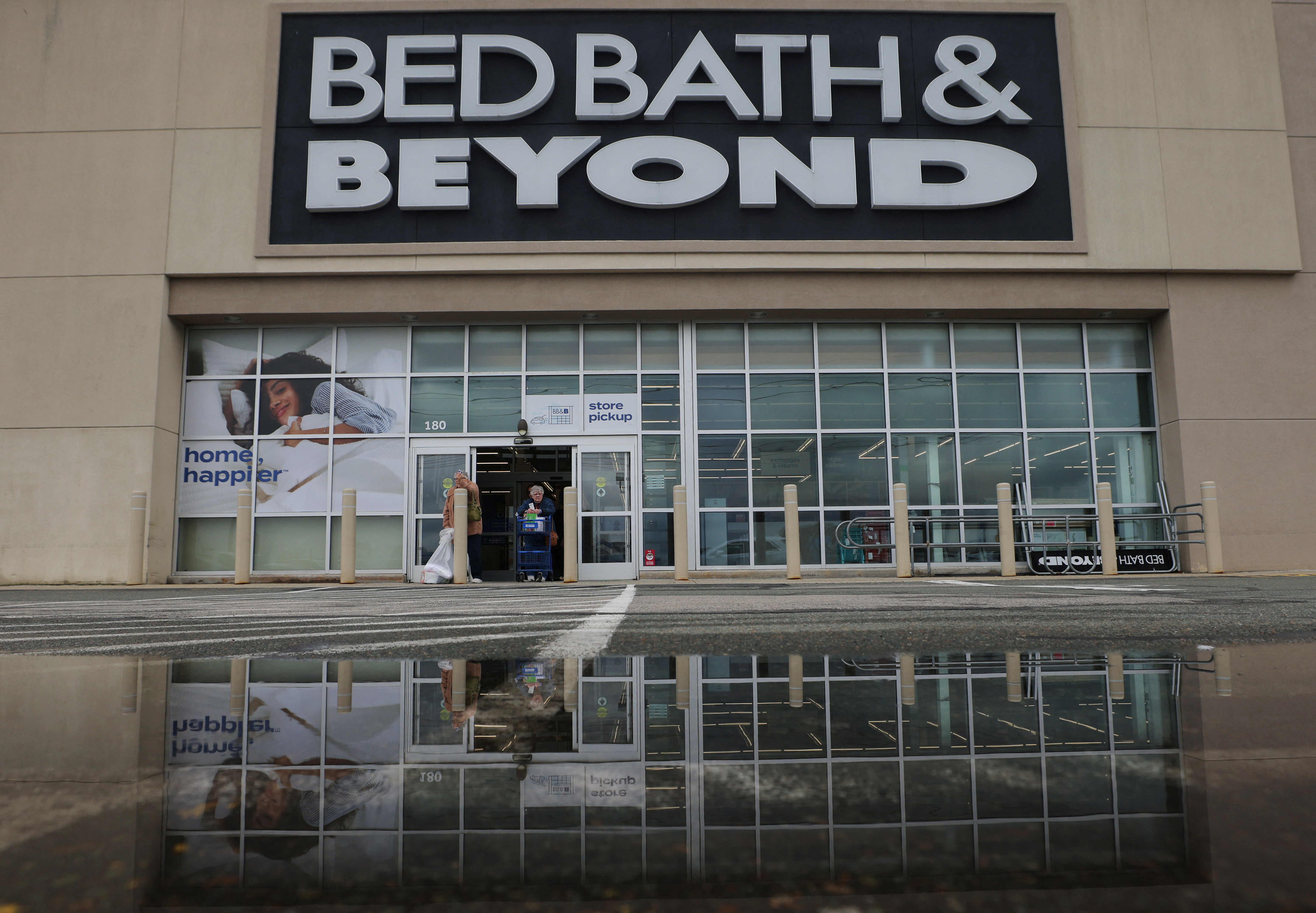 Shoppers leave a Bed Bath & Beyond store in Danvers